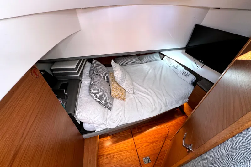 Slide: The Image of Luxurious cabin interior of 2019 Tiara Sport 38 LS yacht with cozy bedding and TV. - 27