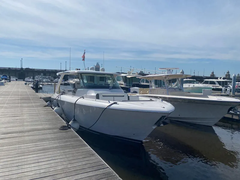 Slide: The Image of 2019 Tiara Sport 38 LS docked at a marina on a sunny day. - 3