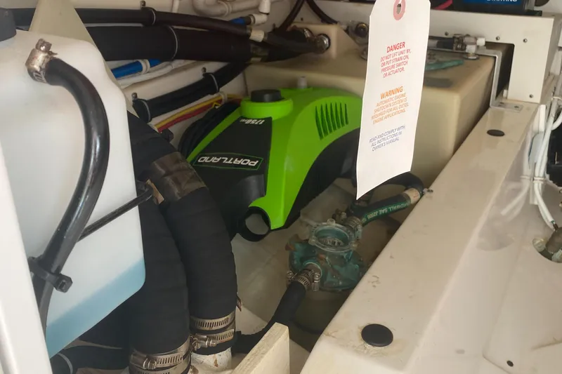 Slide: The Image of Engine compartment of a 2019 Tiara Sport 38 LS boat with Portabote equipment. - 30