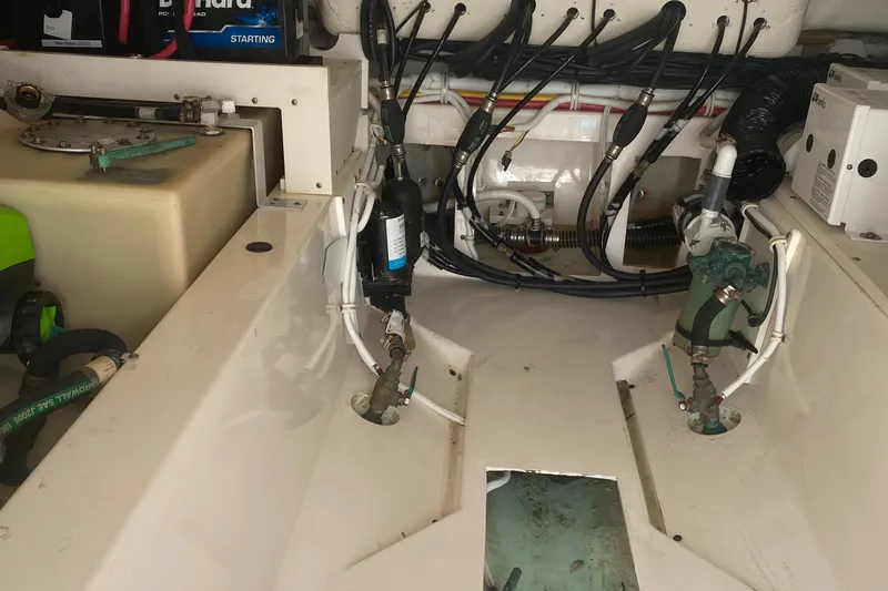 Slide: The Image of Engine compartment of a 2019 Tiara Sport 38 LS boat showing wiring and components. - 31