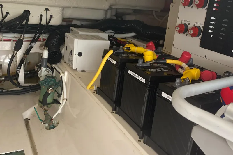 Slide: The Image of 2019 Tiara Sport 38 LS engine compartment with batteries and wiring. - 32