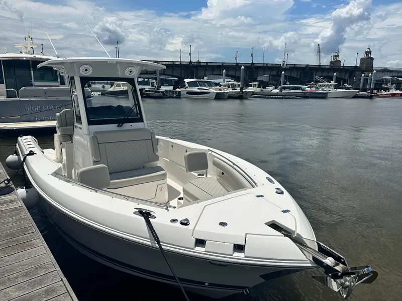 Slide: The Image of 2019 Tiara Sport 38 LS boat docked at marina under cloudy sky. - 4