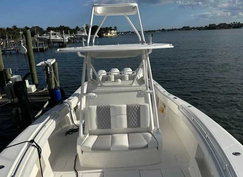 Slide: The Image of 2018 Invincible 39 Open Fisherman boat docked by the water. - 9