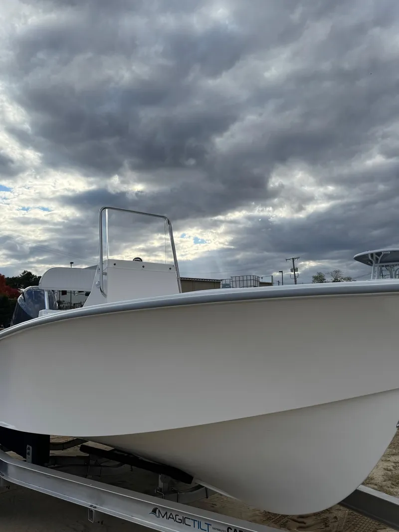 Slide: The Image of 2024 NorthCoast 190 boat on trailer under cloudy sky. - 10