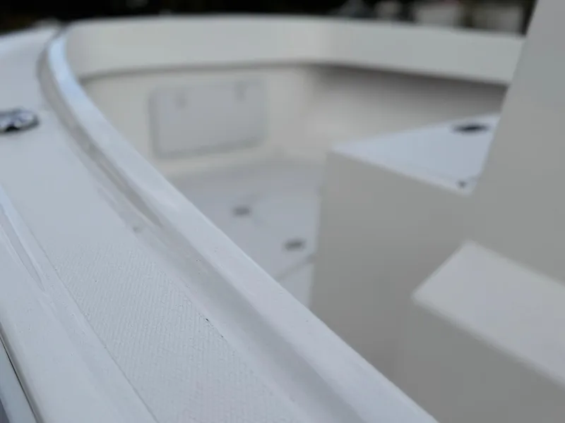 Slide: The Image of 2024 NorthCoast 190 boat interior, showcasing sleek white design and spacious layout. - 12