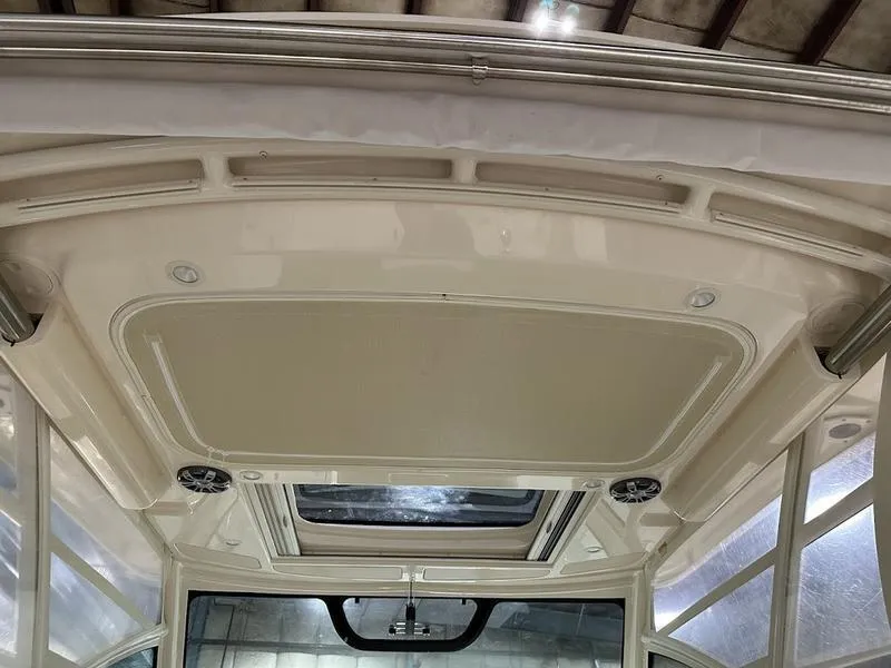 Slide: The Image of 2024 Grady-White Express 330 boat interior ceiling with lighting and ventilation. - 11