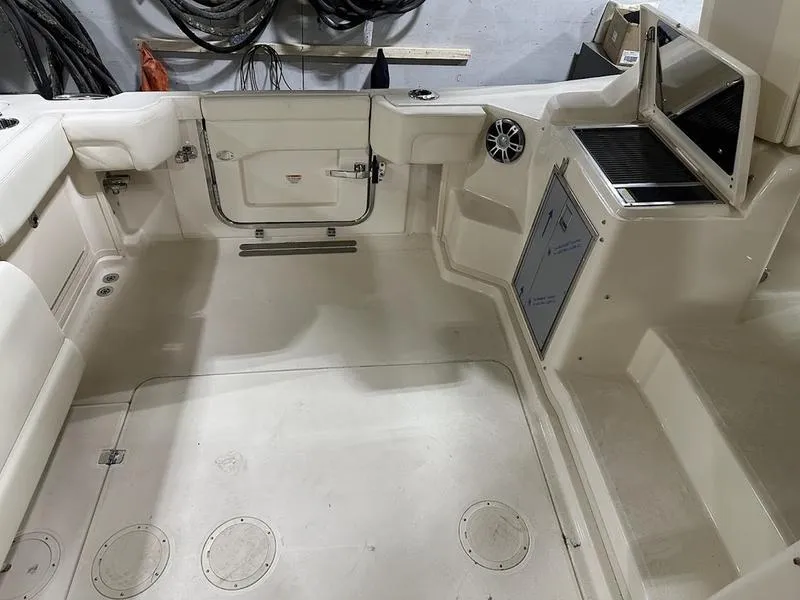 Slide: The Image of 2024 Grady-White Express 330 boat interior, featuring spacious deck and storage compartments. - 12