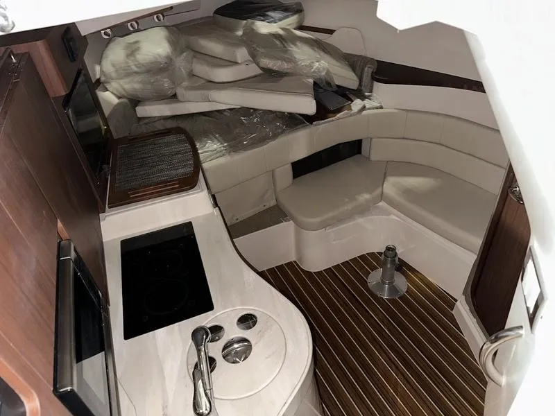 Slide: The Image of Interior of 2024 Grady-White Express 330 boat with modern kitchen and seating area. - 14