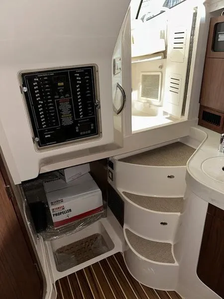 Slide: The Image of 2024 Grady-White Express 330 interior cabin with electrical panel and storage. - 16