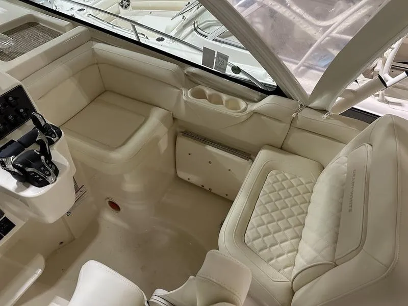 Slide: The Image of 2024 Grady-White Express 330 boat interior with luxurious seating and helm station. - 17