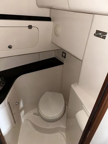 Slide: The Image of 2024 Grady-White Express 330 boat bathroom with modern fixtures and compact design. - 20