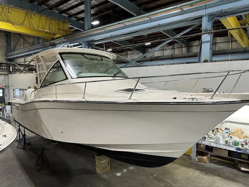 Slide: The Image of 2024 Grady-White Express 330 boat in a warehouse. - 3