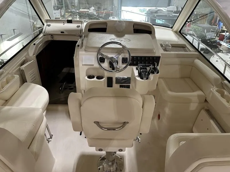 Slide: The Image of 2024 Grady-White Express 330 boat interior with helm station and seating. - 9