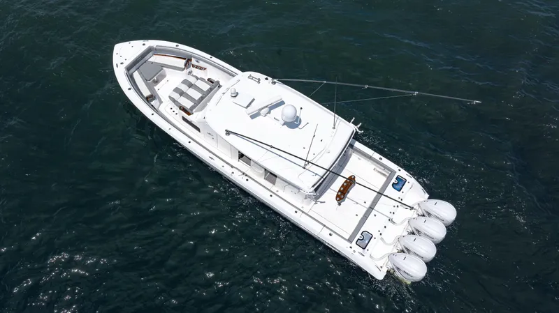 Slide: The Image of Aerial view of 2023 Everglades 455cc boat cruising on open water. - 14