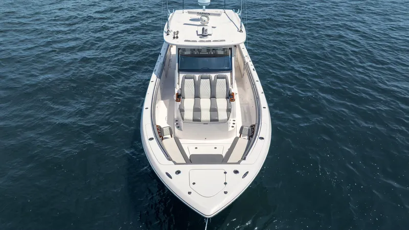 Slide: The Image of Everglades 455cc 2023 boat on open water, aerial view. - 3