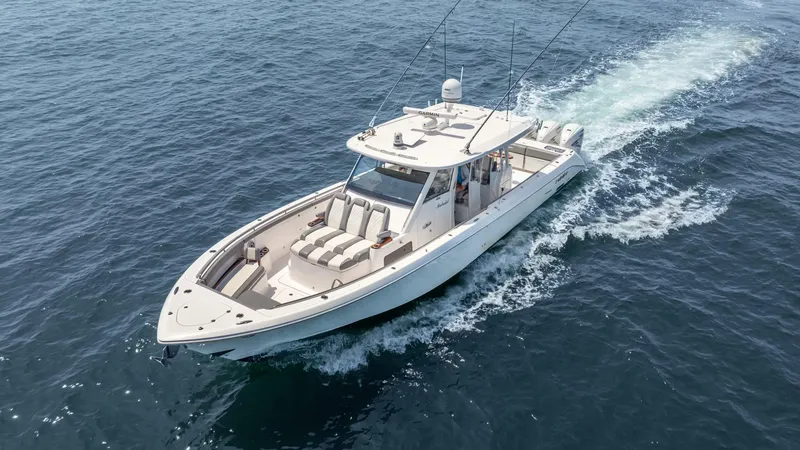 Slide: The Image of 2023 Everglades 455cc boat cruising on open water. - 4