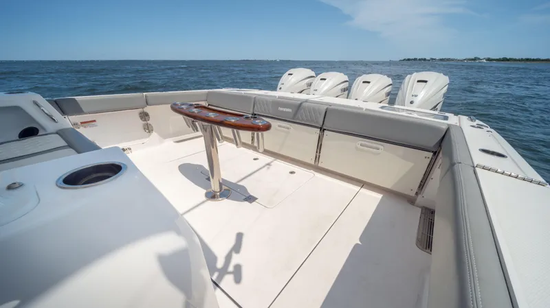 Slide: The Image of 2023 Everglades 455cc boat deck with seating and ocean view. - 5