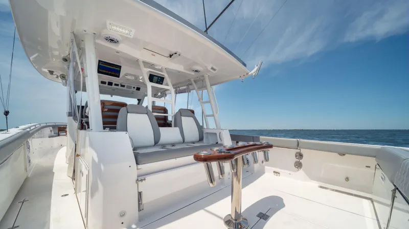 Slide: The Image of 2023 Everglades 455cc boat interior with seating and ocean view. - 6