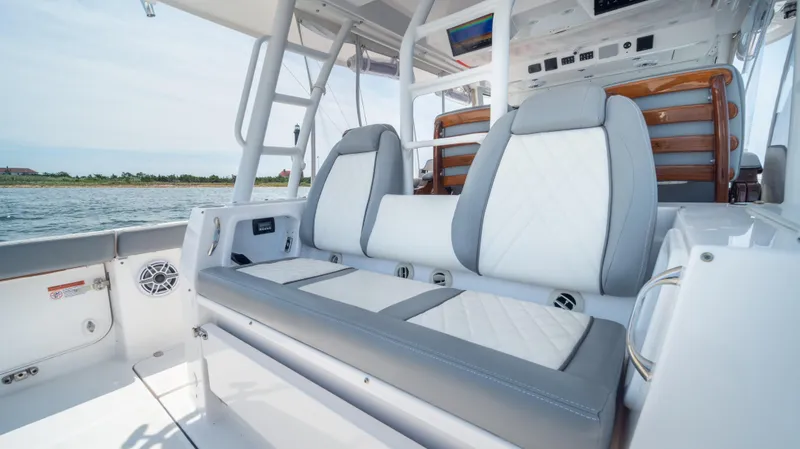 Slide: The Image of 2023 Everglades 455cc boat interior with luxurious seating and modern design. - 8