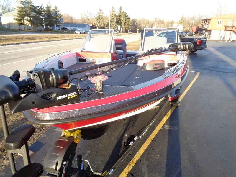 Slide: The Image of 2024 Ranger 621 FS PRO fishing boat on trailer, equipped with Minn Kota trolling motor. - 12
