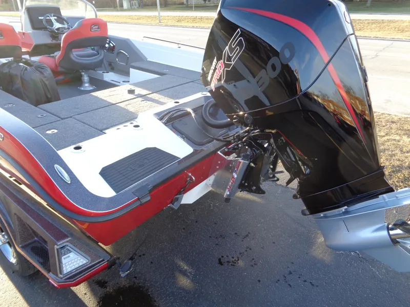Slide: The Image of 2024 Ranger 621 FS PRO boat with powerful outboard motor, spacious deck, and red accents. - 14