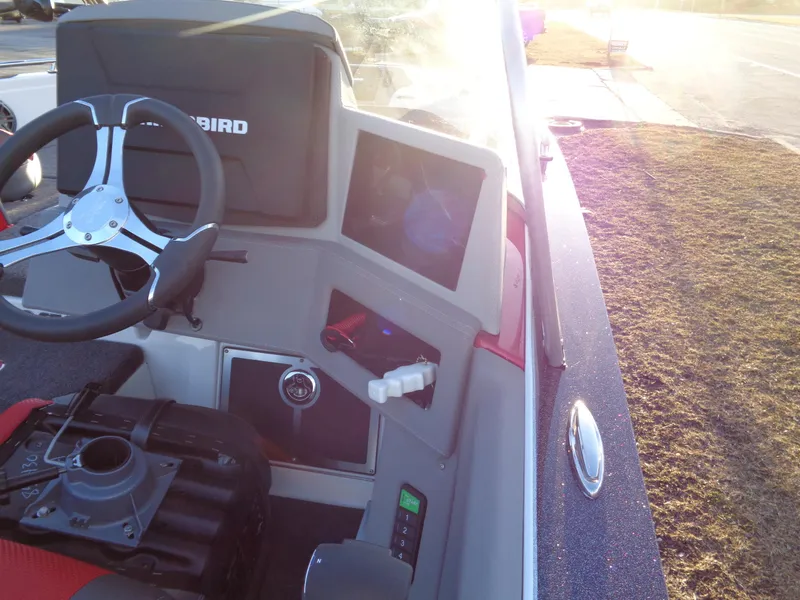 Slide: The Image of 2024 Ranger 621 FS PRO boat dashboard with steering wheel and electronic controls. - 19