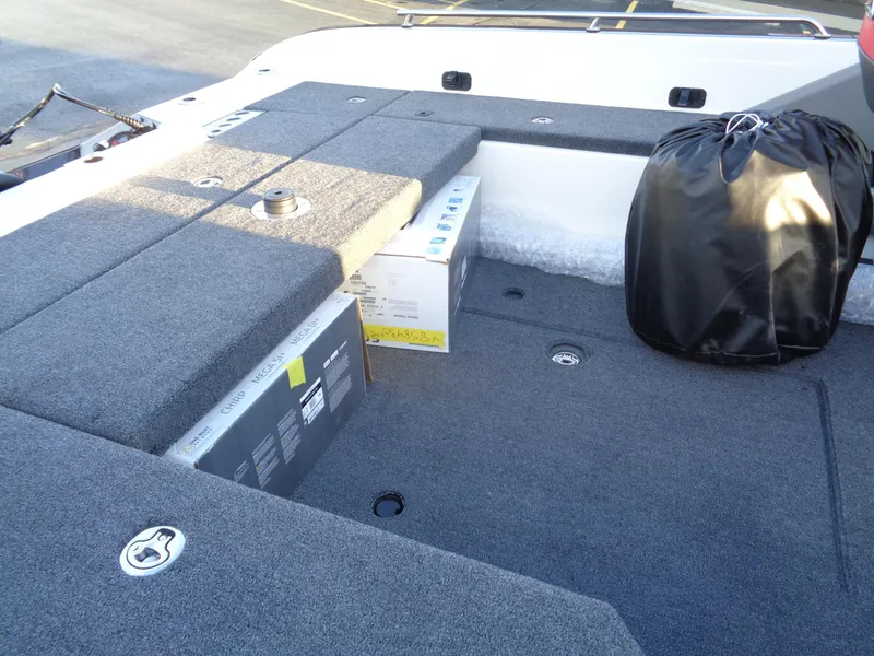 Slide: The Image of 2024 Ranger 621 FS PRO boat interior with storage compartments and gear. - 20