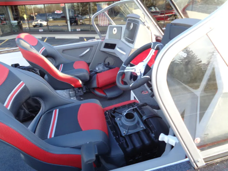 Slide: The Image of 2024 Ranger 621 FS PRO boat interior with red and black seats. - 21