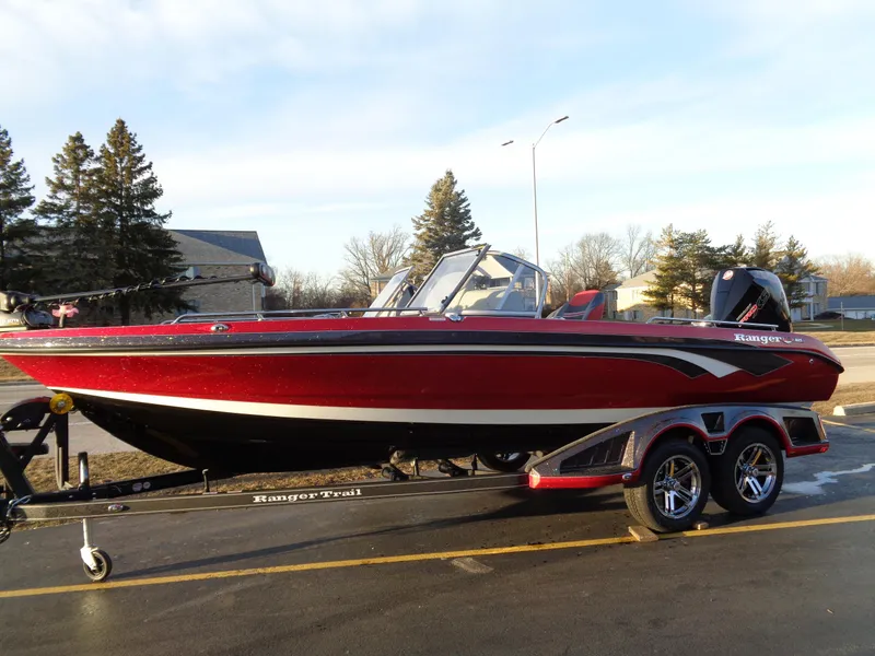 Slide: The Image of 2024 Ranger 621 FS PRO boat on trailer, red and black, side view. - 3