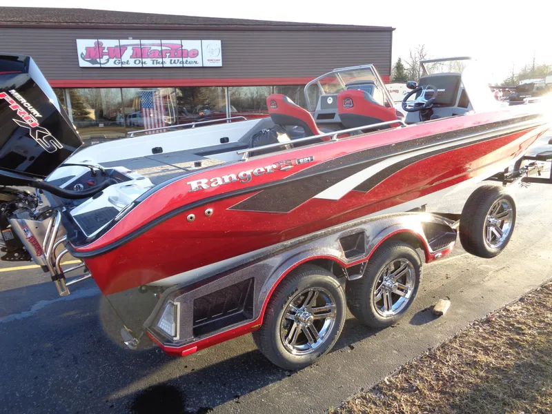 Slide: The Image of 2024 Ranger 621 FS PRO boat in red, parked outside a dealership. - 6