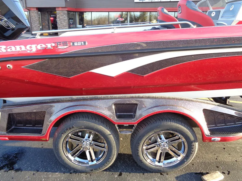 Slide: The Image of 2024 Ranger 621 FS PRO boat with dual-axle trailer, red and black design. - 7