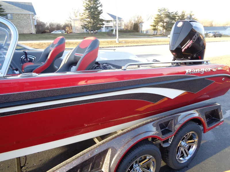 Slide: The Image of 2024 Ranger 621 FS PRO boat with red and black design on trailer. - 9