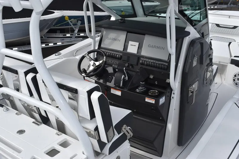 Slide: The Image of 2024 Blackfin 272CC boat cockpit with Garmin navigation system. - 11