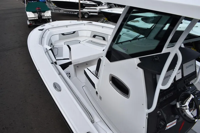 Slide: The Image of 2024 Blackfin 272CC center console boat with spacious seating and modern design. - 16