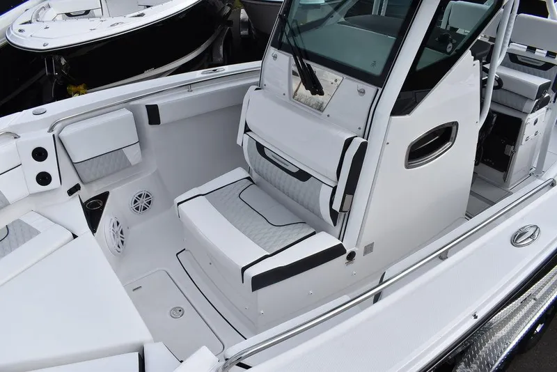 Slide: The Image of 2024 Blackfin 272CC boat interior with seating and console. - 18