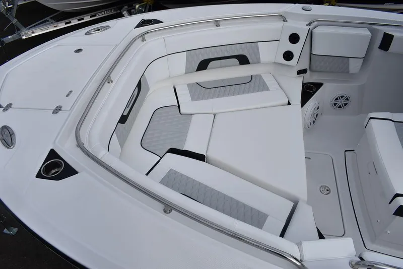 Slide: The Image of 2024 Blackfin 272CC boat interior with cushioned seating and modern design. - 19