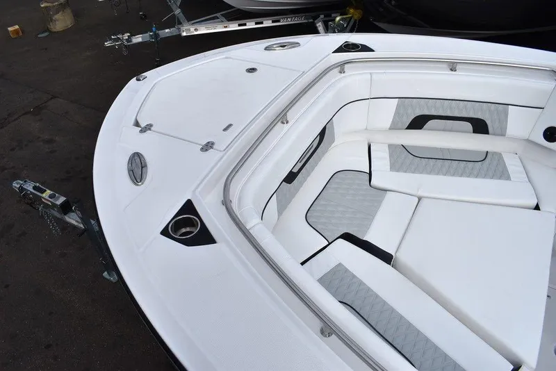 Slide: The Image of 2024 Blackfin 272CC boat bow with white and gray cushioned seating. - 20