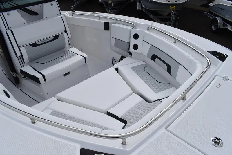 Slide: The Image of 2024 Blackfin 272CC boat interior with cushioned seating and stainless steel rail. - 23