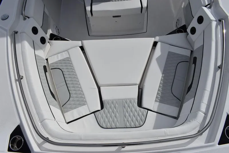 Slide: The Image of 2024 Blackfin 272CC boat interior seating area with white and gray upholstery. - 27