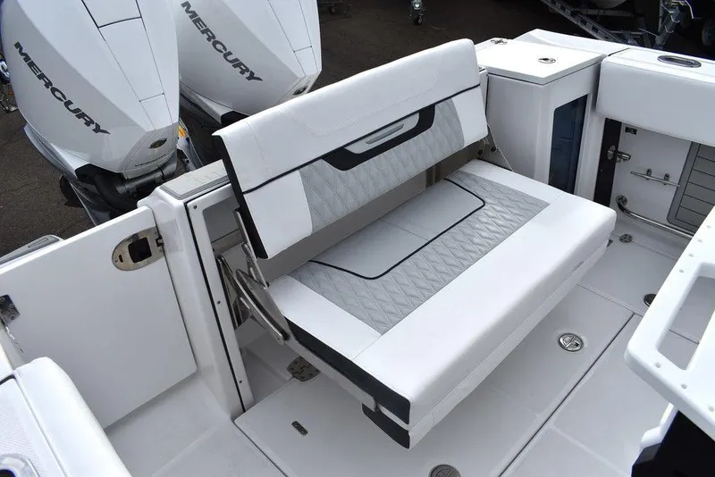 Slide: The Image of 2024 Blackfin 272CC boat with foldable seating and twin Mercury engines. - 36