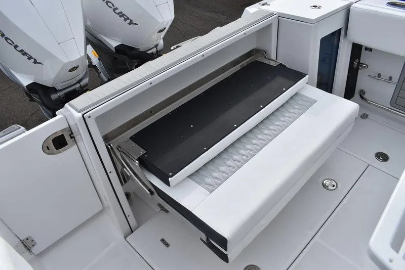 Slide: The Image of 2024 Blackfin 272CC boat with foldable bench seat and twin Mercury engines. - 37