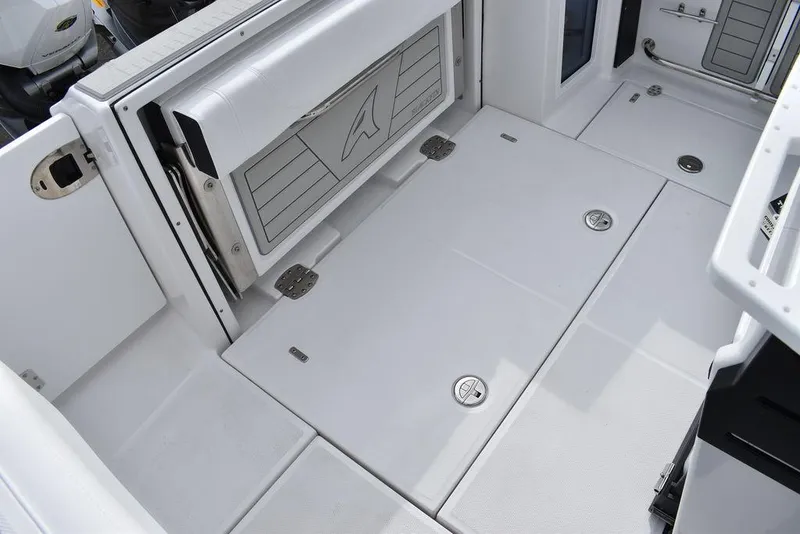 Slide: The Image of 2024 Blackfin 272CC boat deck with storage compartments and foldable seating. - 38