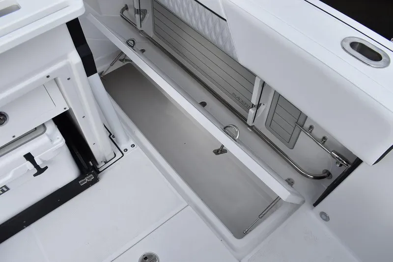 Slide: The Image of 2024 Blackfin 272CC boat storage compartment with open hatch. - 47