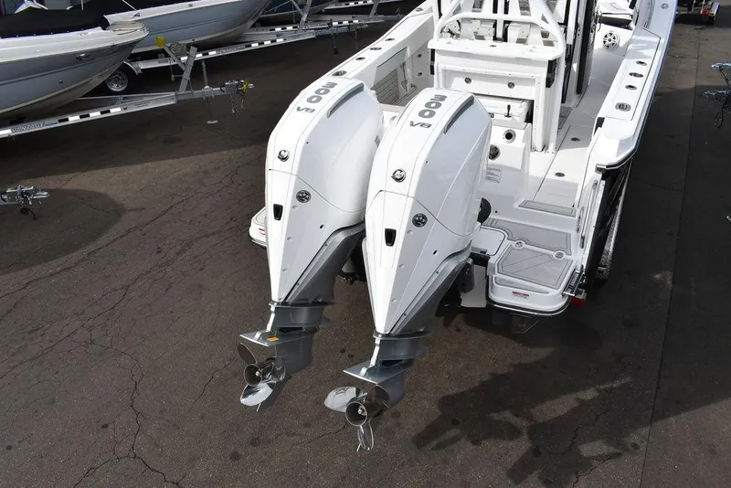 Slide: The Image of 2024 Blackfin 272CC boat with twin outboard engines, rear view. - 5