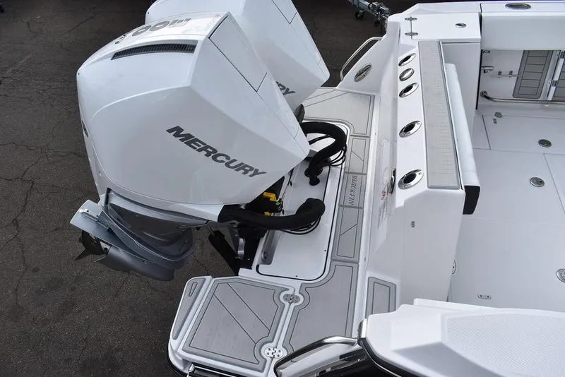 Slide: The Image of 2024 Blackfin 272CC boat with twin Mercury outboard engines. - 7