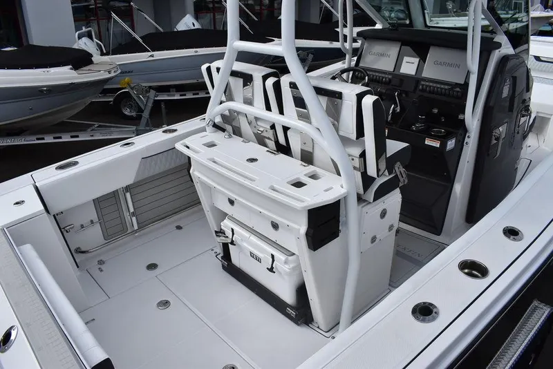 Slide: The Image of 2024 Blackfin 272CC center console boat interior with seating and control panel. - 9