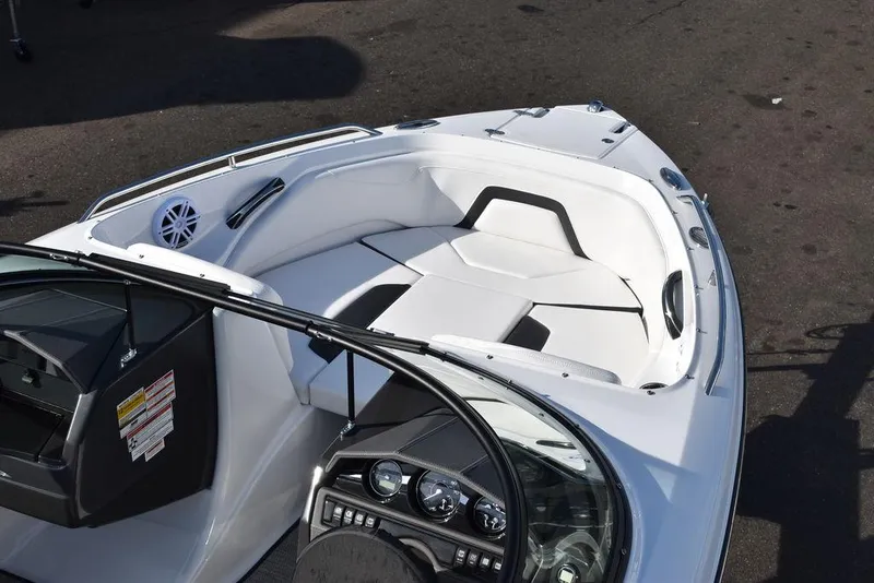 Slide: The Image of 2024 Monterey 224FS boat interior with white seating and dashboard. - 11