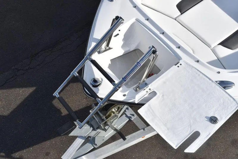 Slide: The Image of 2024 Monterey 224FS boat with a foldable ladder and storage compartment. - 19