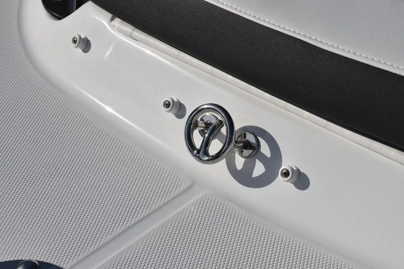 Slide: The Image of 2024 Monterey 224FS boat deck with chrome logo and fittings. - 27
