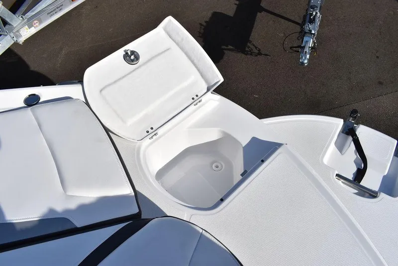 Slide: The Image of 2024 Monterey 224FS boat with open storage compartment and seating area. - 28